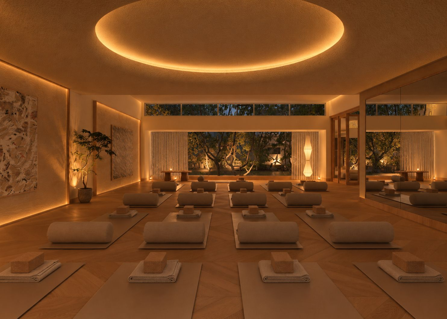 NARA’s warmly lit movement studio with mats and bolsters